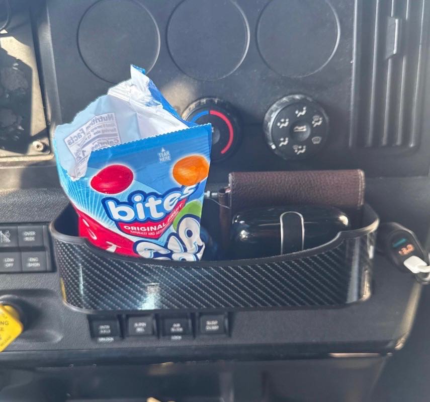 Customer photo of a loaded carbon-pattern dash tray